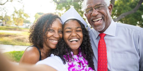 A family celebrating a graduate together